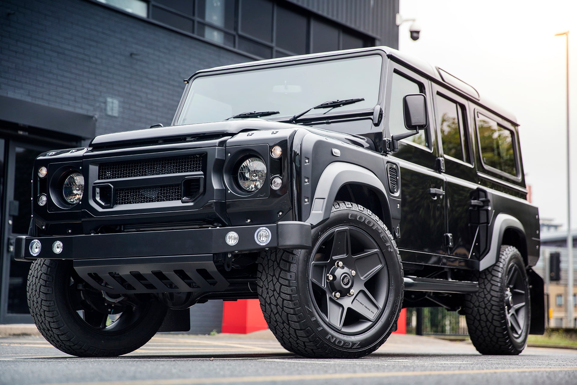 License To Drive: Chelsea Truck Company Aston Martin Storm Black Land Rover Defender 110 Station Chelsea Wide Track