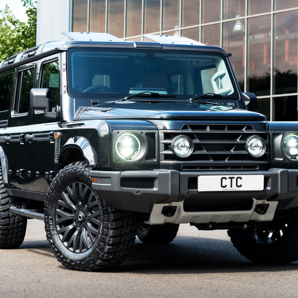 Black Ineos Grenadier With The Front Sump guard, Front grille with light mounts & mesh, Side vents , side door entry steps, foldable sun roof and wheels Tailored by Kahn