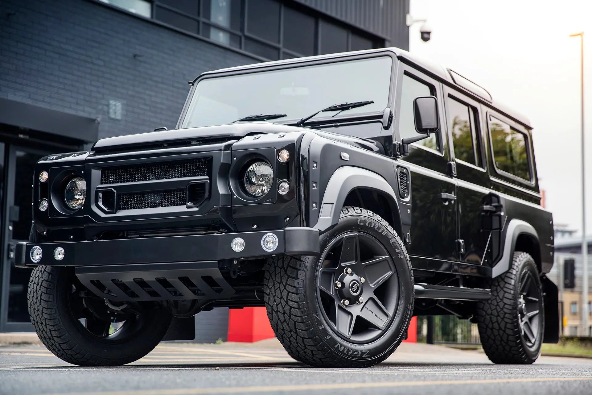 License To Drive: Chelsea Truck Company Aston Martin Storm Black Land Rover Defender 110 Station Chelsea Wide Track - Chelsea Truck Company