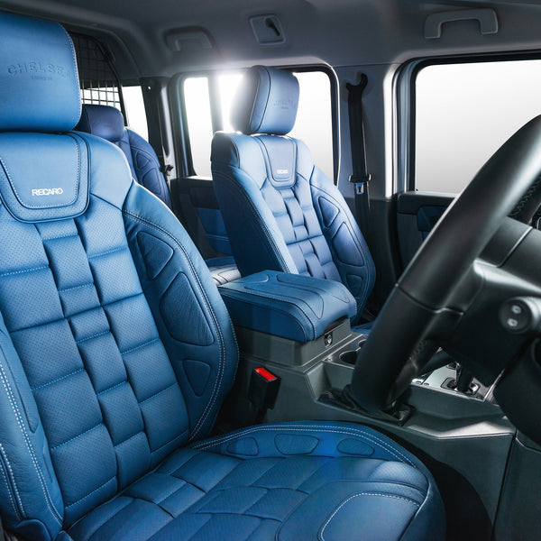 Side View of The Ineos Grenadier With Blue leather seat, steering wheel, seat belt and door panel by kahn