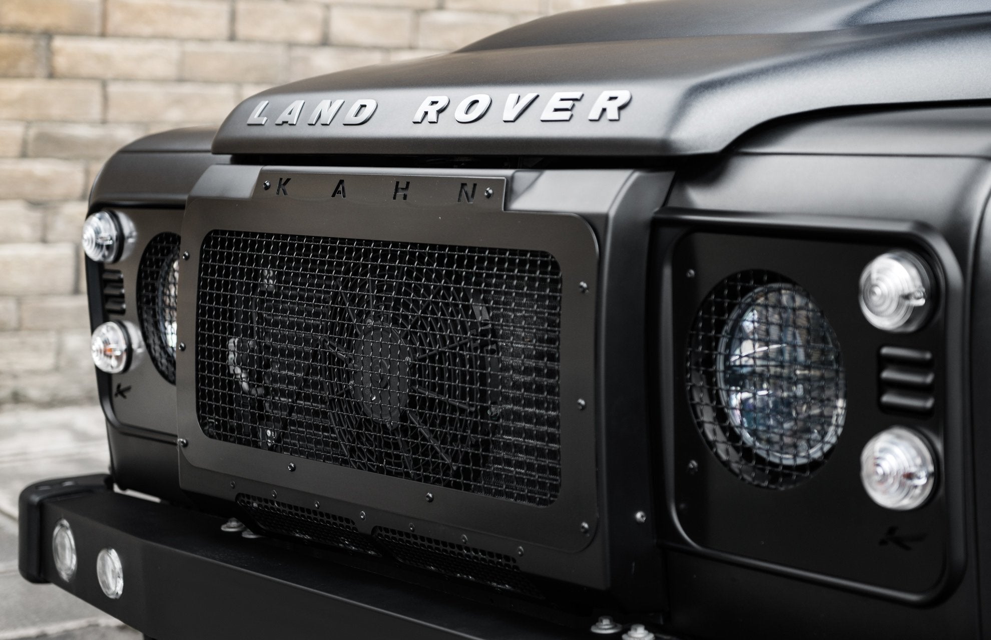 The Side View Of The Land Rover Defender (1991-2016) Kahn front grille with stainless steel mesh By Chelsea Truck Company