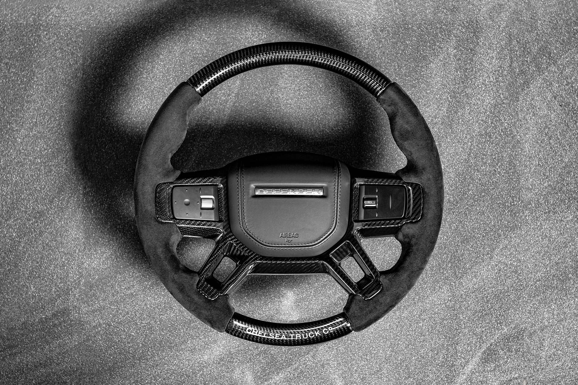 The Top View Of The Buy carbon steering wheel for Defender By Chelsea Truck Company