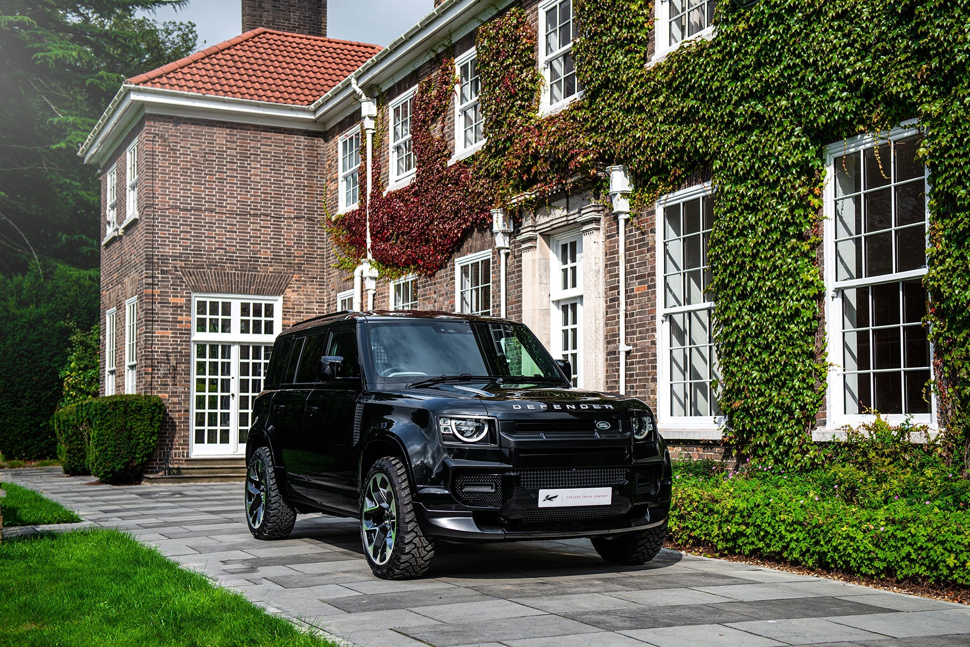 Wider View Of The Black Land Rover Defender 130 (2020-Present) Landmark Body Kit By Chelsea Truck Company