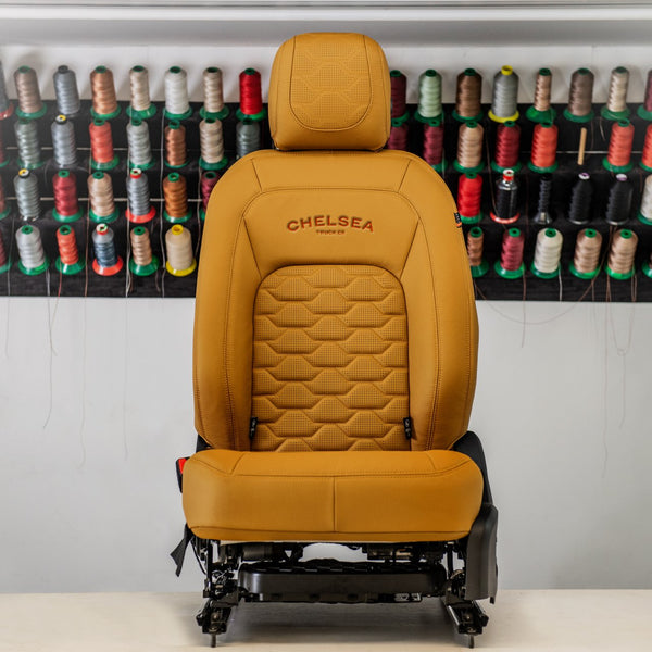 The Front View Of The Luxury vehicle yellow leather upholstery By Kahn